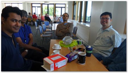 Celebrating Steve Ooi's birthday, with Tim making faces